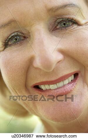 Stock Photo - Middle Aged Woman Smiling At The Camera. Fotosearch