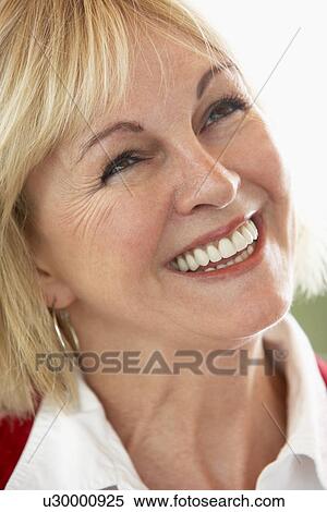 Stock Photography - Middle Aged Woman Smiling Cheerfully. Fotosearch