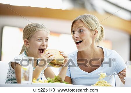 Mother And Daughter Having Lunch Together At The Mall View Large Photo Image Stock Image - Mother And Daughter Having Lunch Together At The Mall. Fotosearch
