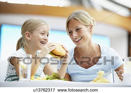 Mother And Daughter Having Lunch Together At The Mall View Large Photo Image Stock Photo - Mother And Daughter Having Lunch Together At The Mall. Fotosearch