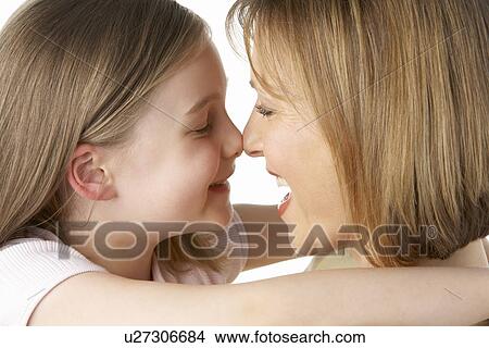 Mother And Daughter Smiling At Each Other View Large Photo Image Picture - Mother And Daughter Smiling At Each Other. Fotosearch