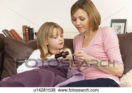 Mother Giving Medicine To Sick Daughter View Large Photo Image Stock Photo - Mother Giving Medicine To Sick Daughter. Fotosearch