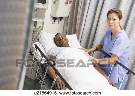 Stock Photograph - Nurse Caring For Patient. Fotosearch
