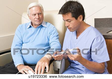 Stock Photograph - Nurse Giving Patient An Injection. Fotosearch