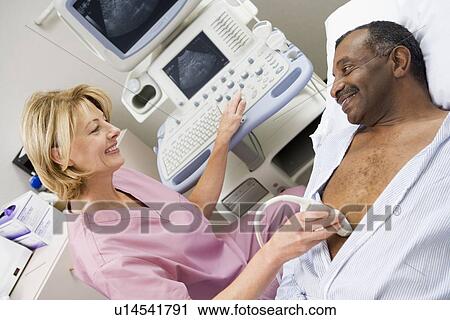Nurse Giving Patient An Ultra Sound View Large Photo Image Stock Image - Nurse Giving Patient An Ultra Sound . Fotosearch