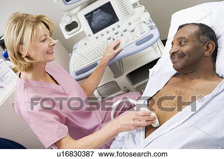 Stock Photo - Nurse Giving Patient An Ultra Sound . Fotosearch