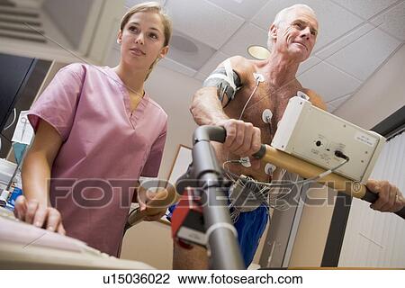 Nurse With Patient During Health Check View Large Photo Image Stock Image - Nurse With Patient During Health Check. Fotosearch