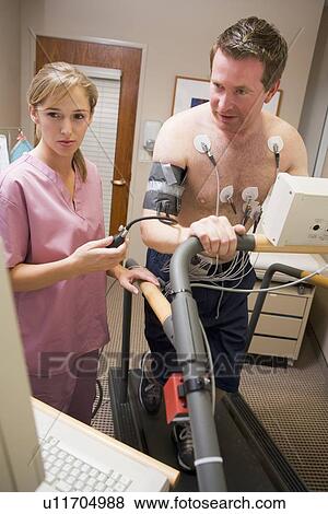 Nurse With Patient During Health Check View Large Photo Image Stock Photo - Nurse With Patient During Health Check. Fotosearch