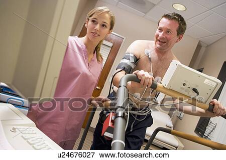 Nurse With Patient During Health Check View Large Photo Image Stock Photo - Nurse With Patient During Health Check. Fotosearch