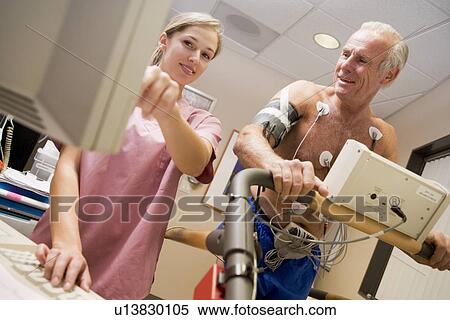 Stock Photography - Nurse With Patient During Health Check. Fotosearch