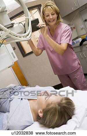Stock Photo - Nurse With Patient Having An X-Ray. Fotosearch