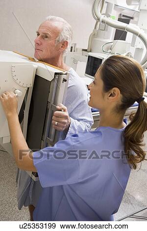 Stock Photo - Nurse With Patient Having An X-Ray. Fotosearch