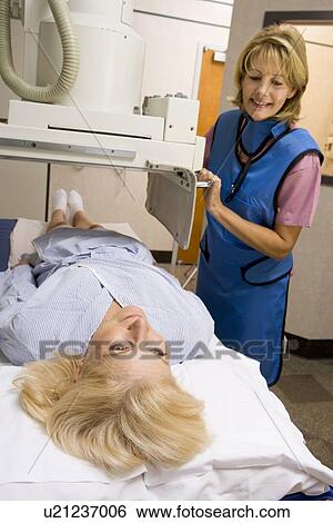 Stock Photograph - Nurse With Patient Having An X-Ray. Fotosearch