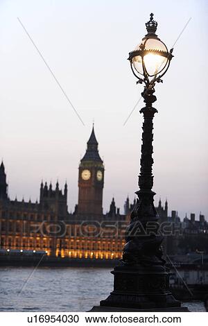 Old-Fashioned Street Lamp With Houses Of Parliament Illuminated In The Background, London, England View Large Photo Image Stock Image - Old-Fashioned Street Lamp With Houses Of Parliament Illuminated In The Background, London, England. Fotosearch