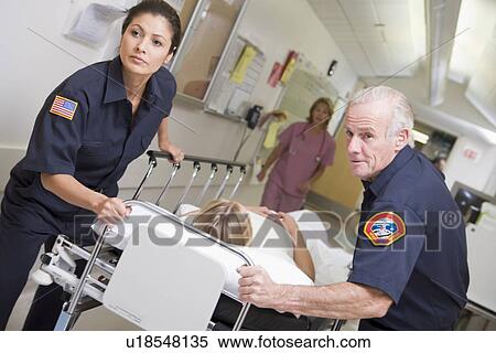 Paramedics Rushing Emergency Patient Into Hospital View Large Photo Image Stock Photography - Paramedics Rushing Emergency Patient Into Hospital. Fotosearch