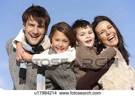 Picture - Parents Piggy Backing Their Children. Fotosearch