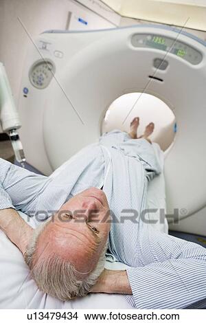 Picture - Patient About To Have A Computerized Axial Tomography (CAT) Scan. Fotosearch