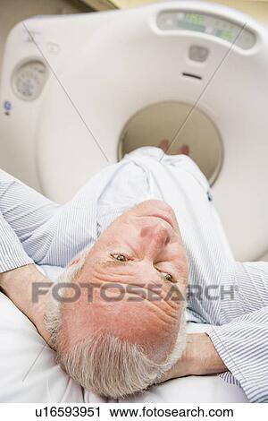 Stock Image - Patient About To Have A Computerized Axial Tomography (CAT) Scan. Fotosearch