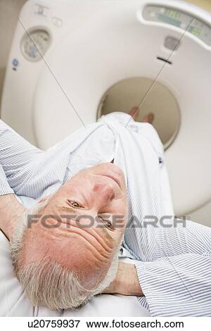 Stock Photo - Patient About To Have A Computerized Axial Tomography (CAT) Scan. Fotosearch