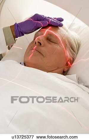 Stock Photo - Patient Having A Computerized Axial Tomography (CAT) Scan. Fotosearch