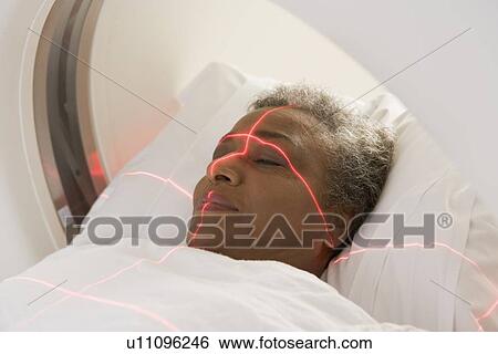 Patient Having A Computerized Axial Tomography (CAT) Scan View Large Photo Image Stock Photograph - Patient Having A Computerized Axial Tomography (CAT) Scan. Fotosearch