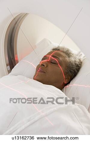 Stock Photograph - Patient Having A Computerized Axial Tomography (CAT) Scan. Fotosearch