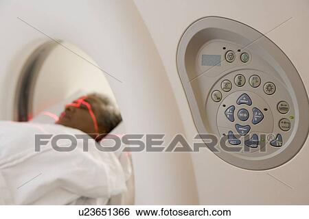 Stock Photograph - Patient Having A Computerized Axial Tomography (CAT) Scan. Fotosearch