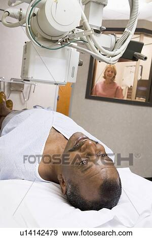 Patient Having An X-Ray View Large Photo Image Stock Photo - Patient Having An X-Ray. Fotosearch