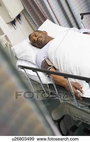 Patient In Hospital Bed View Large Photo Image Stock Photo - Patient In Hospital Bed . Fotosearch