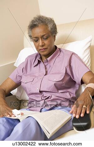 Patient Reading A Magazine View Large Photo Image Stock Image - Patient Reading A Magazine. Fotosearch
