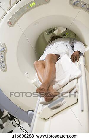 Stock Photo - Patient Undergoing For A Computerized Axial Tomography (CAT) Scan. Fotosearch