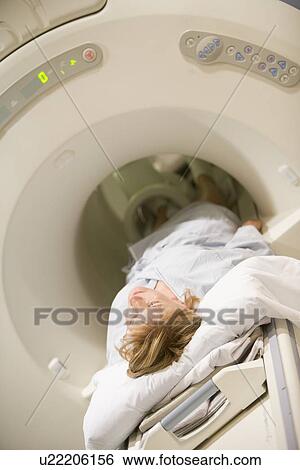Patient Undergoing For A Computerized Axial Tomography (CAT) Scan View Large Photo Image Stock Photograph - Patient Undergoing For A Computerized Axial Tomography (CAT) Scan. Fotosearch