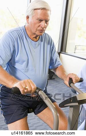 Patient Working Out On Exercise Machine View Large Photo Image Stock Photography - Patient Working Out On Exercise Machine. Fotosearch