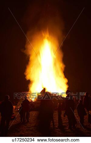 People Standing Around A Big Bonfire At Night View Large Photo Image Picture - People Standing Around A Big Bonfire At Night. Fotosearch