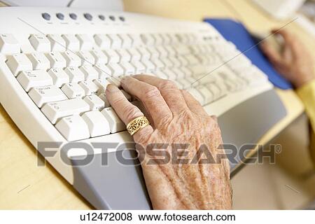 Person using computer View Large Photo Image Stock Photo - Person using computer. Fotosearch