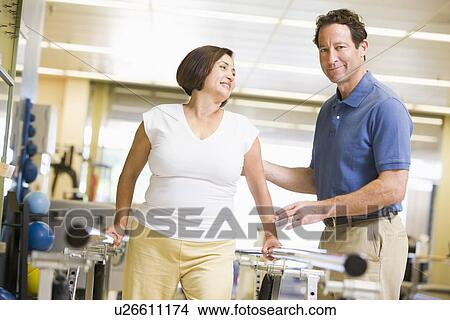 Picture - Physiotherapist With Patient In Rehabilitation. Fotosearch