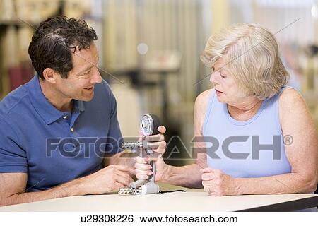 Physiotherapist With Patient In Rehabilitation View Large Photo Image Stock Photograph - Physiotherapist With Patient In Rehabilitation. Fotosearch