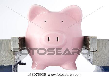 Piggy Bank In Jaws Of Vice Against White Background View Large Photo Image Stock Photograph - Piggy Bank In Jaws Of Vice Against White Background. Fotosearch