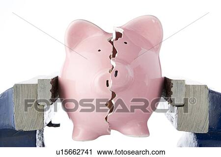 Piggy Bank Split In Two Whilst Being Held In Vice View Large Photo Image Stock Image - Piggy Bank Split In Two Whilst Being Held In Vice. Fotosearch