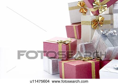 Pile Of Colourful Christmas Presents Against White Background View Large Photo Image Picture - Pile Of Colourful Christmas Presents Against White Background. Fotosearch