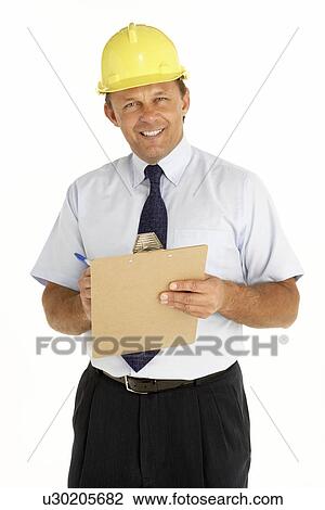Portrait Of A Foreman Writing On A Clipboard View Large Photo Image Stock Image - Portrait Of A Foreman Writing On A Clipboard. Fotosearch