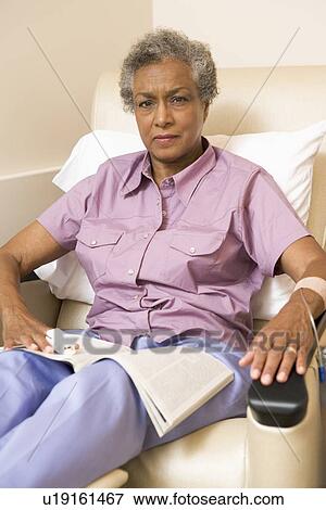 Portrait Of A Patient With A Magazine View Large Photo Image Stock Photo - Portrait Of A Patient With A Magazine. Fotosearch