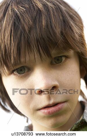 Stock Image - Portrait Of Boy Frowning. Fotosearch