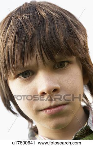 Stock Image - Portrait Of Boy Frowning. Fotosearch