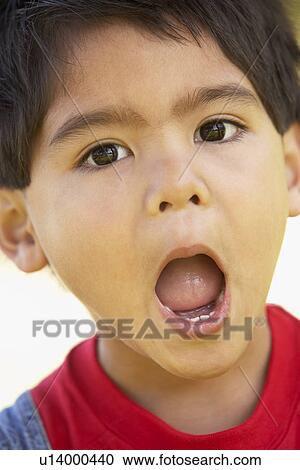Stock Image - Portrait Of Boy Looking Surprised. Fotosearch