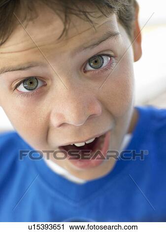 Stock Image - Portrait Of Boy Looking Surprised. Fotosearch
