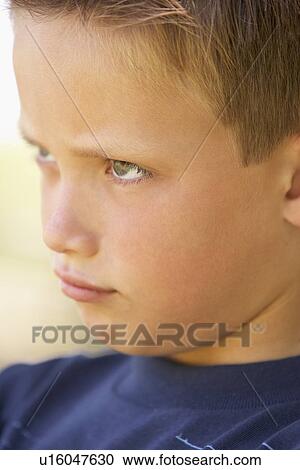 Stock Image - Portrait Of Boy Pouting. Fotosearch