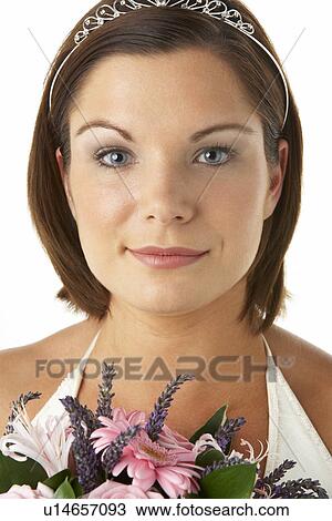 Stock Image - Portrait Of Bride Holding Bouquet Of Flowers. Fotosearch