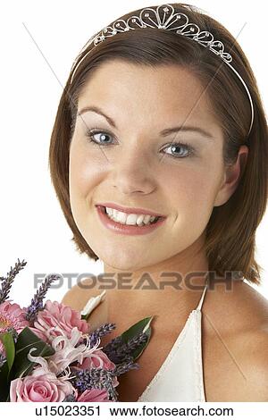 Stock Image - Portrait Of Bride Holding Bouquet Of Flowers. Fotosearch