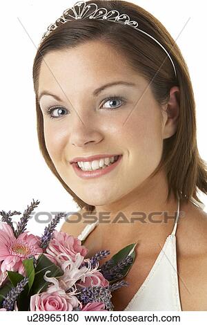 Stock Image - Portrait Of Bride Holding Bouquet Of Flowers. Fotosearch